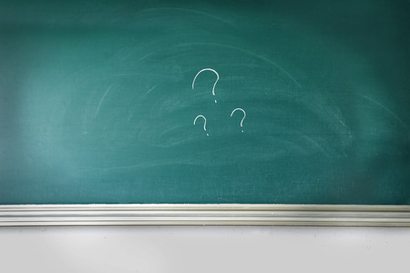 question mark on the blackboard in the classroomの写真素材