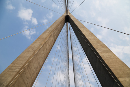 Cables and supports of bridge in china against blue skyの写真素材