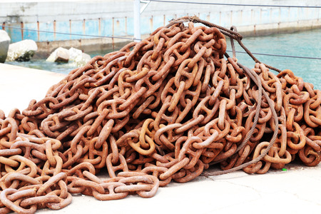 a leap of old chain near the seaの写真素材