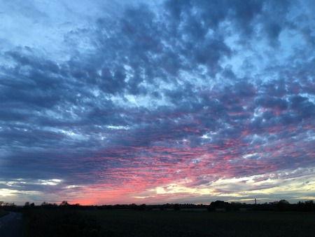 Cloudy and dramatic sunset in southern Englandの写真素材