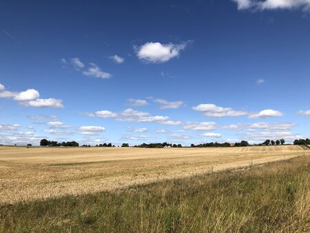 Perfect summer sky over English fieldの写真素材