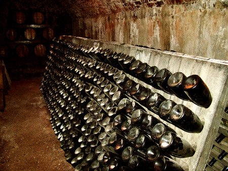 Historical wine rack in heritage winery cellar storage areaの写真素材