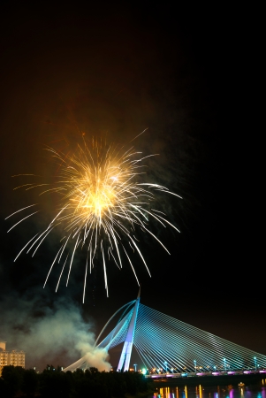 Putrajaya bridge with fireworks above it の写真素材