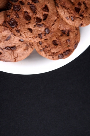 Chocolate chips cookies in a bowl and black backgroundの写真素材