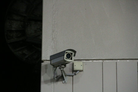 Surveillance camera on wall