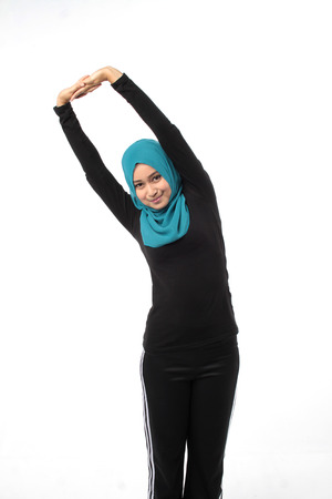 Asian girl doing aerobic move at studioの写真素材