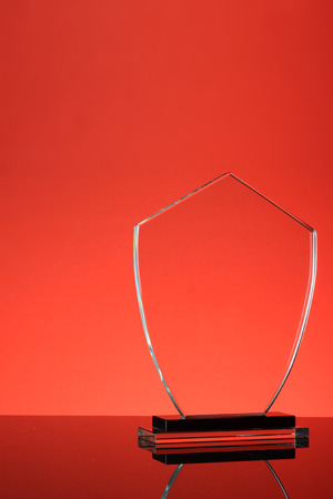 glass trophy in red backgroundの写真素材