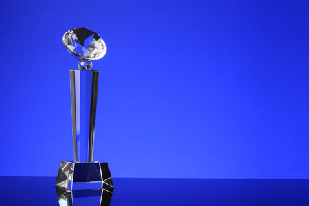 glass trophy in blue backgroundの写真素材