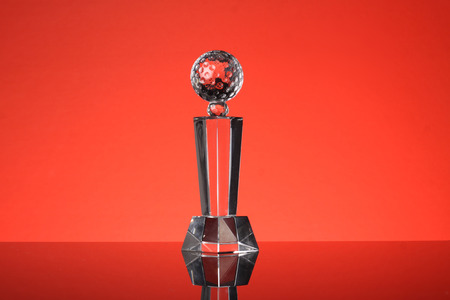 glass trophy in red backgroundの写真素材