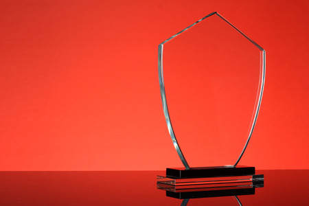 glass trophy in red backgroundの写真素材