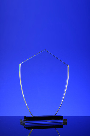 glass trophy in blue backgroundの写真素材