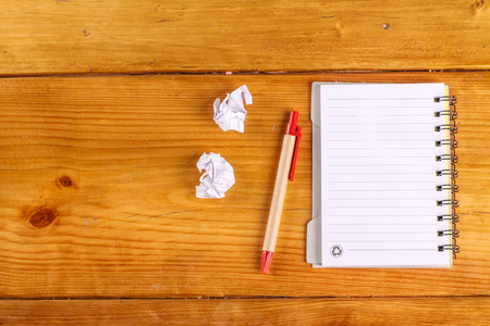 notebook on wood backgroundの写真素材