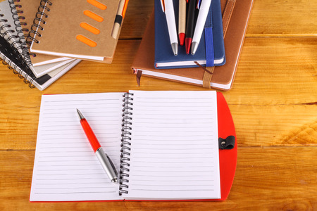 stationaries isolated on wooden backgroundの写真素材