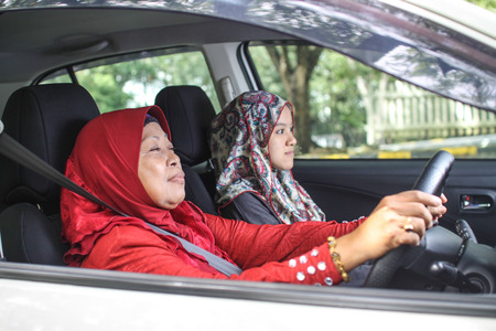two muslim women in the carの写真素材