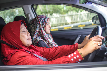 two muslim women in the carの写真素材
