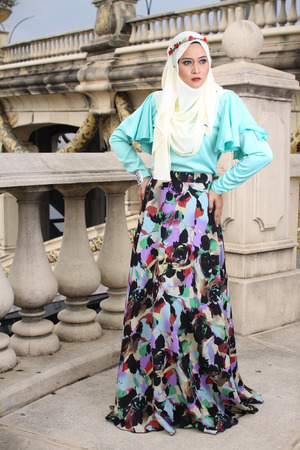 high fashion muslim women posing at bridgeの写真素材