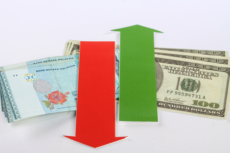 malaysian and the united states of america's  money with red and green arrowの写真素材
