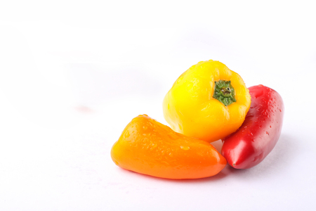 three types of pickled pepper isolated on white backgroundの写真素材