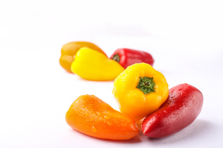 three types of pickled pepper isolated on white backgroundの写真素材