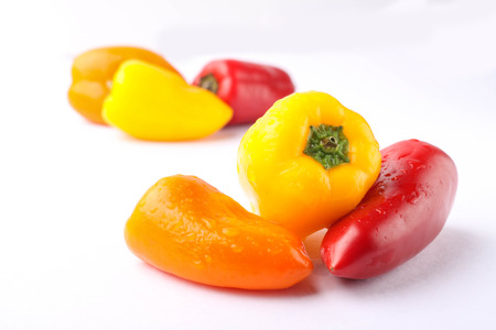 three types of pickled pepper isolated on white backgroundの写真素材