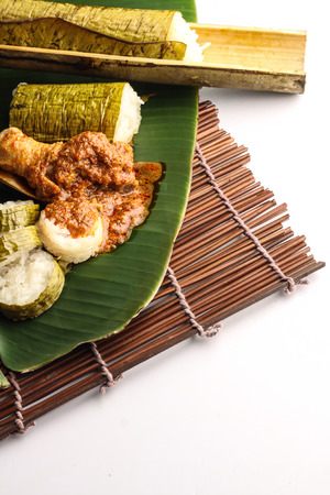 malay lemang served with rendang ayamの写真素材