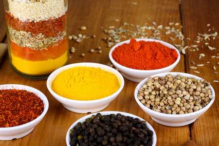mixed spices and herb with wood backgroundの写真素材