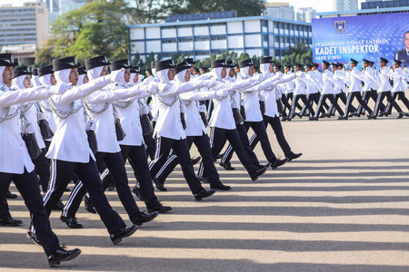 KUALA LUMPUR - NOV 7 : Newly grad Malaysian Cadet Inspector doing a parade run to complete their nine month training on November 7, 2015 at PDRM Training Centre Kuala Lumpur Malaysia.のeditorial素材