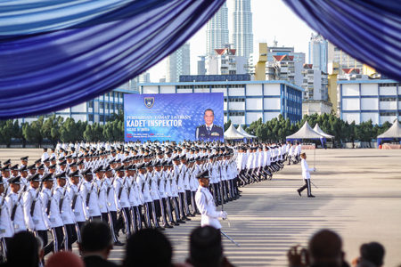 KUALA LUMPUR - NOV 7 : Newly grad Malaysian Cadet Inspector doing a parade run to complete their nine month training on November 7, 2015 at PDRM Training Centre Kuala Lumpur Malaysia.のeditorial素材