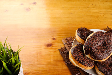 concept of chocholate doughnuts with wood palet backgroundの写真素材