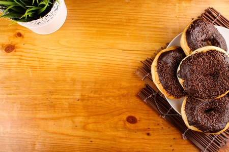 concept of chocholate doughnuts with wood palet backgroundの写真素材