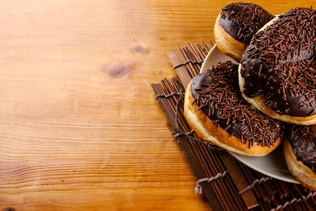 concept of chocholate doughnuts with wood palet backgroundの写真素材