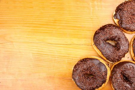 concept of chocholate doughnuts with wood palet backgroundの写真素材