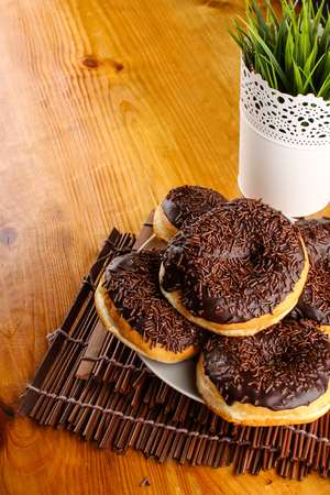 concept of chocholate doughnuts with wood palet backgroundの写真素材