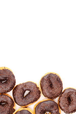chocholate doughnuts isolated in white backgroundの写真素材