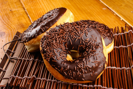 concept of chocholate doughnuts with wood palet backgroundの写真素材