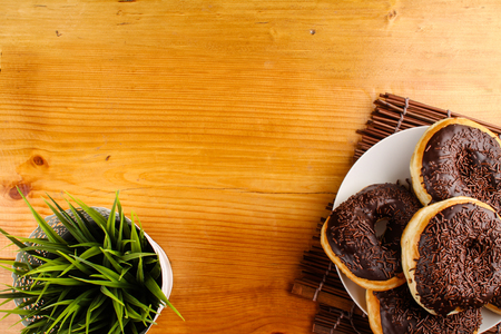 concept of chocholate doughnuts with wood palet backgroundの写真素材