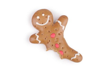 Gingerbread man decorated colored icing. Holiday cookie in shape of  man isolated in white backgroundの写真素材
