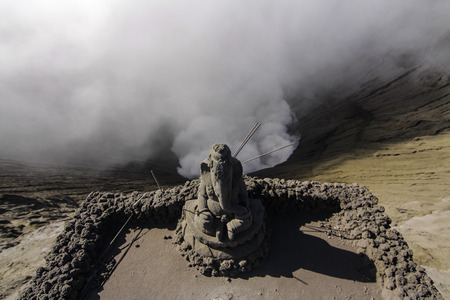 hindu praying statue on mount Bromo craterの写真素材