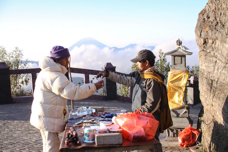 BROMO, INDONESIA - NOVEMBER 17: A local sells coffee at Bromo Tengger Semeru National Park. Tourism is one of the main income for them in here 17 November 2015.のeditorial素材