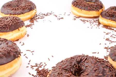 chocolate doughnuts with empty content space in the middleの写真素材