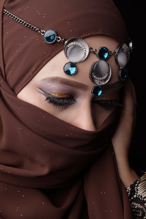 Malaysian malay woman posing with different normal and smiling expression with arabic theme lookの写真素材