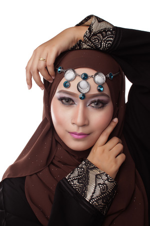 Malaysian malay woman posing with different normal and smiling expression with arabic theme lookの写真素材