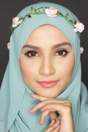 portrait of young asian beautiful muslimah woman posing for a cameraの写真素材