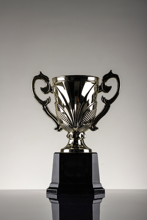 winning trophy shot in gray background champion awardの写真素材