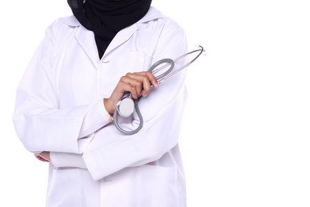 muslimah doctor holding a stethoscope isolated in white backgroundの写真素材