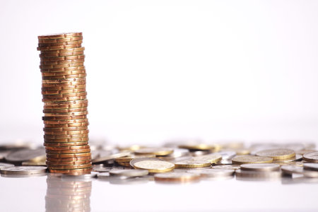 Gold coins stacked up isolated on white background