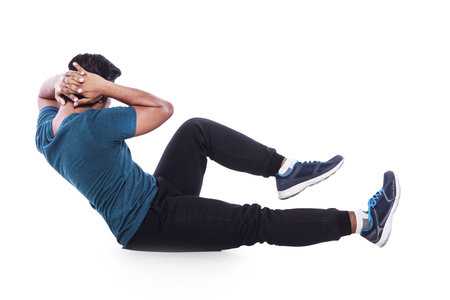 young man doing sit up isolated on white background