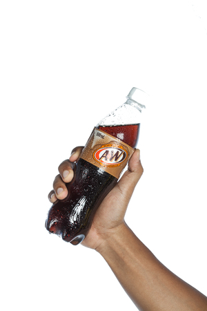 Shah Alam, Malaysia - 25 January 2017. A&W soft drink in hold by a hand.のeditorial素材