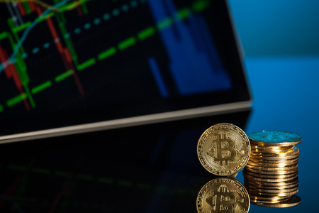 bitcoin with blue background technology with tablet and smartphone の写真素材