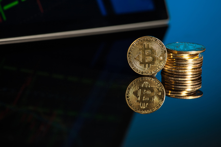 bitcoin with blue background technology with tablet and smartphone の写真素材